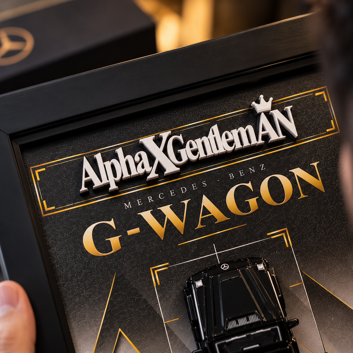Close-up of raised 3D AlphaXGentlemAN title on G-Wagon frame
